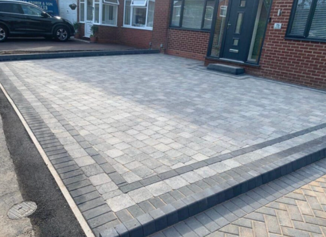 Freshly laid block paving driveway leading to a house