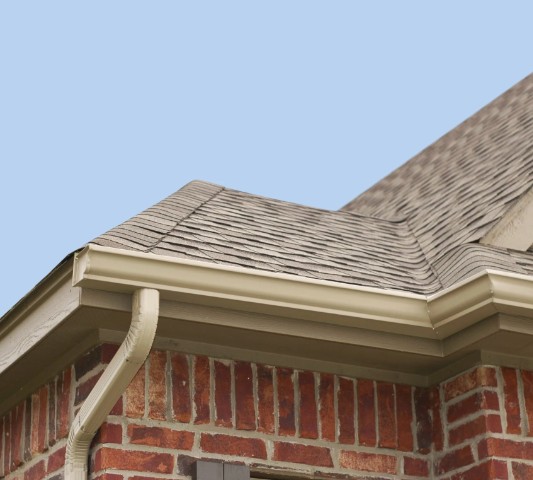 Clean white fascias and soffits on a traditional stone house